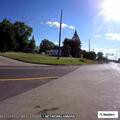 Pickup runs red light and drives off roadway