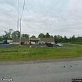 Car stuck on utility pole wire near Boonville store
