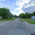 Fallen tree blocks road and damages vehicle