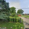 Suspicious person sitting on front porch