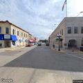 Vehicle towed for parade setup on Oak Street