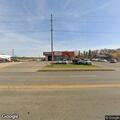 Suspicious tire loading at auto shop parking lot
