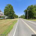Tree partially blocking road near auto shop on Route 4A West