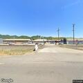 Smoke near barbed wire at lumber mill