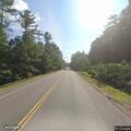 Truck hits pole and brings down wires on Route 104