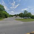 Store employee reports man lying outside entrance