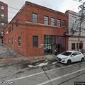 Woman experiencing eye pain near Portland Street