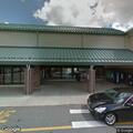 Person hanging outside vehicle door at Hannaford