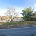 Vehicles leave lot as officer approaches store