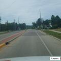 Officer monitoring vehicle road hazard on South Union