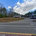 Person bent over in truck at Chadbourne Road lot