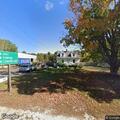 Dumpster fire near building on Walnut Hill Road