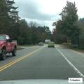 Disabled rental car in bad spot near country store