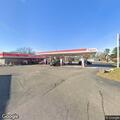 Officer stops blue Chevy hatchback at gas station