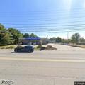 Officer checks white SUV outside Sherwin-Williams