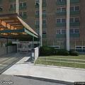 Person passed out on bench at Midtown Towers