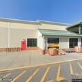 Man found lying in grass at Bradford store