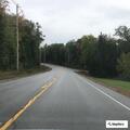 Driver reports unsafe pass by dump truck on Route 11