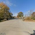Abandoned crashed sedan blocking road in Breese