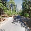 Vehicle with flat tire on shoulder near Sierra View