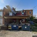 Illegal dumping of furniture behind restaurant