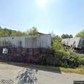 Male requests medical help at auto repair shop