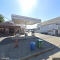 Car drives through roadblock and stops at gas station
