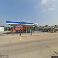 Unoccupied running vehicle at gas station