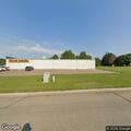 Vehicle hits pole in store parking lot