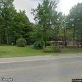 Side-by-side rollover injures man in front yard