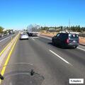 Motorcycle weaving through traffic on Highway 97