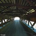 Two cars stopped near Jackson covered bridge