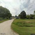 Pickup truck rolls over in front yard crash