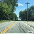Vehicle smoking and leaking oil on roadside