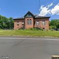 Grass pile in roadway creates traffic hazard