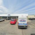 RV crash with fluid leak at gas station lot