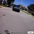 Car making loud exhaust noise near First Street light
