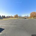Person experiencing abdominal pain at sports complex