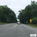Traffic stop involving black Subaru with covered plate