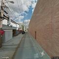 Officer checks person in alley after disturbance