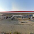 Person tries to kick through gas station glass