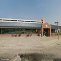 Person needing medical help near bench at transit center