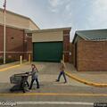 Person dancing in roadway near Target store