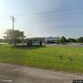 Woman lying on road near hospital in Manistee