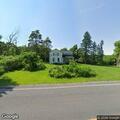Downed power line between house and barn with animals