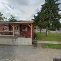 Vehicle stop at motel parking lot on Route 26