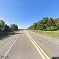 Trees leaning on wire along County Road K