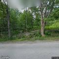 Trees block Bear Pond Road in Hartford