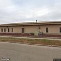 Female in her 70s falls outside motel apartment