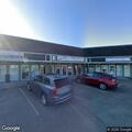 Driver hits curb in parking lot on Alsea Highway